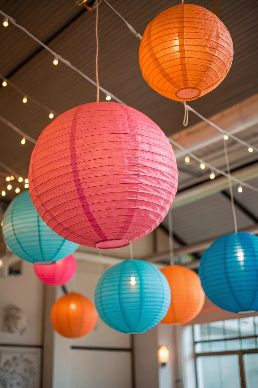 Create a whimsical atmosphere with hanging paper lanterns that add color and charm to any party setting. 🎈✨ #PaperLanterns #PartyDecor